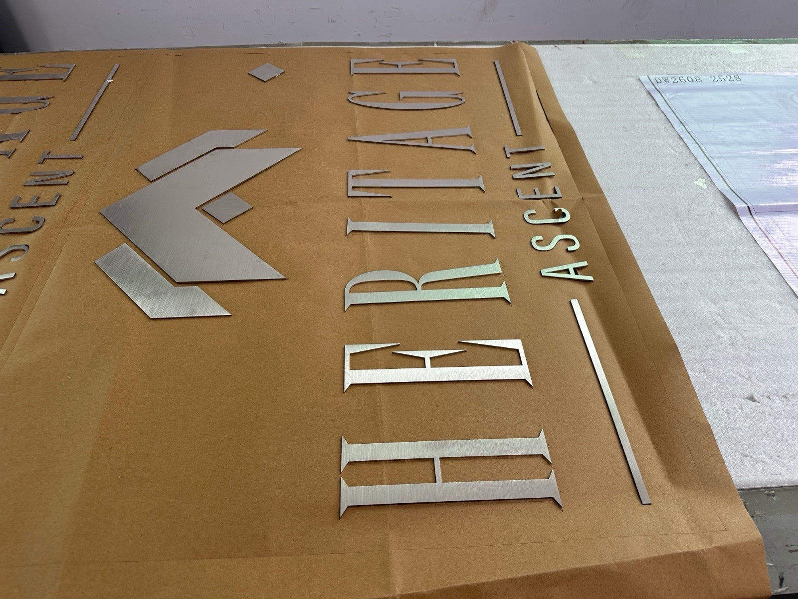Custom Fabricated Stainless Steel Sign for Jess Garrett